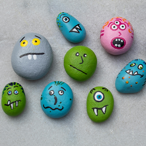 Rocks painted with silly faces.